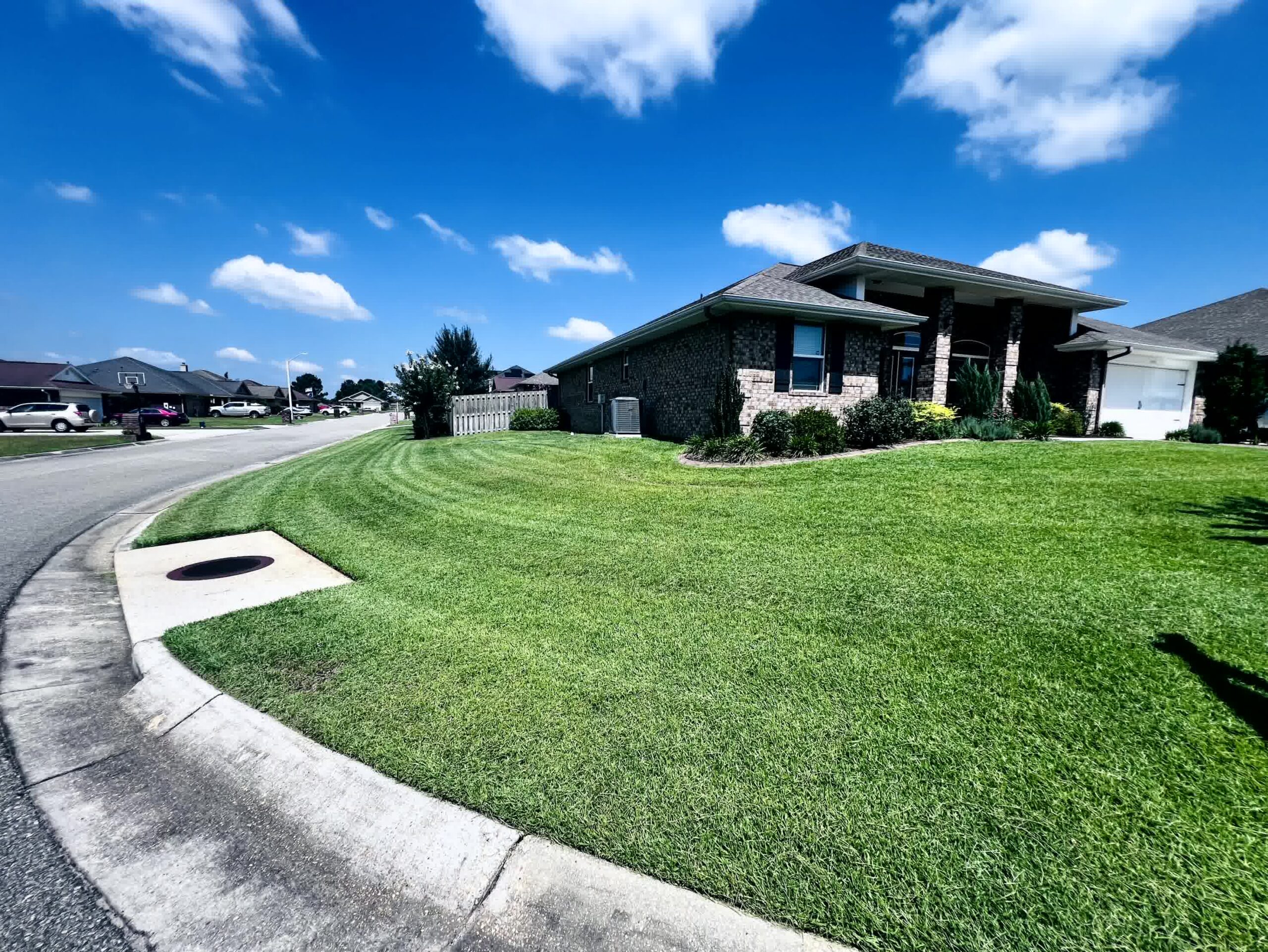 A Beautiful home and lawn after being pressure washed.